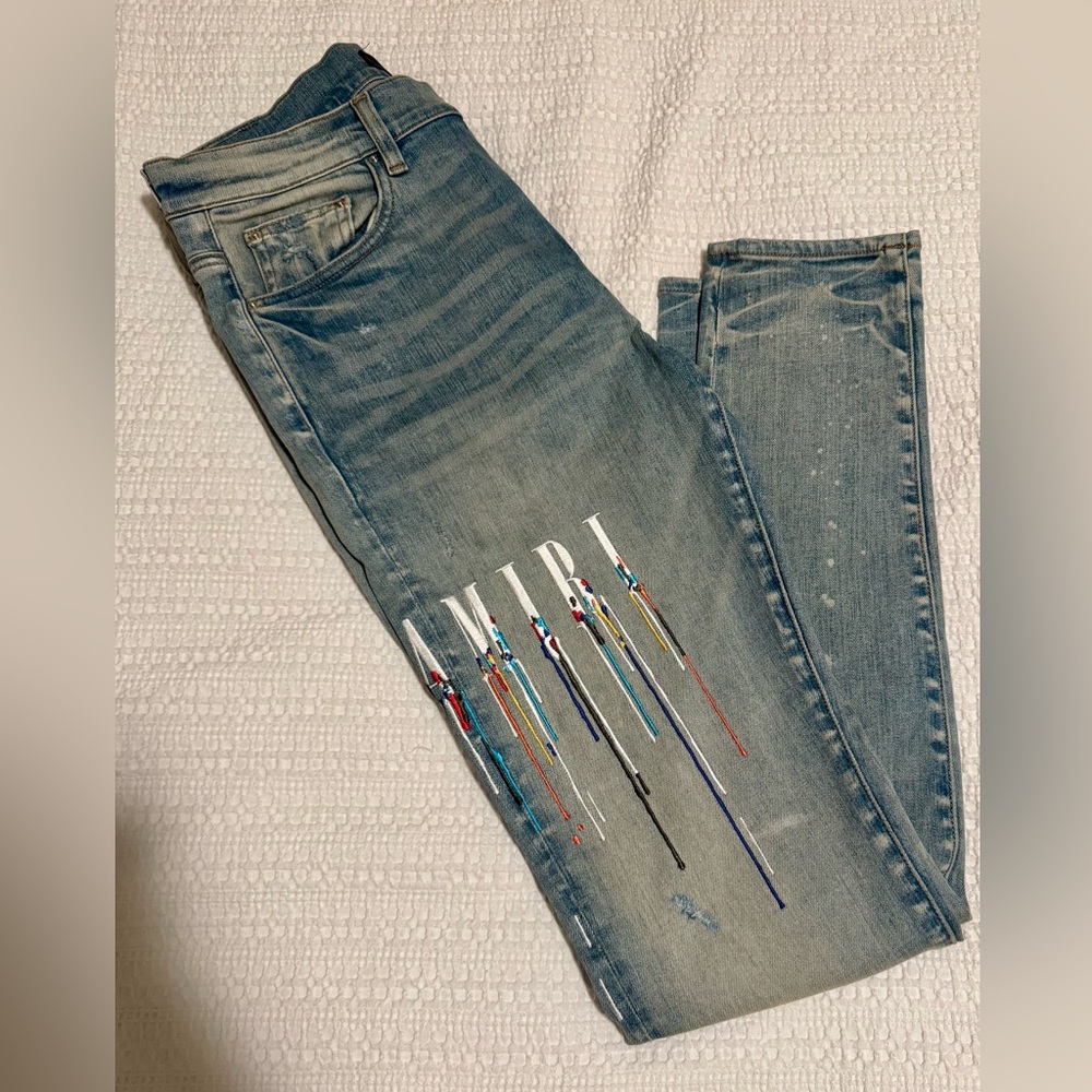 Men’s AMIRI Blue Jeans with Multicolor Paint Streaks